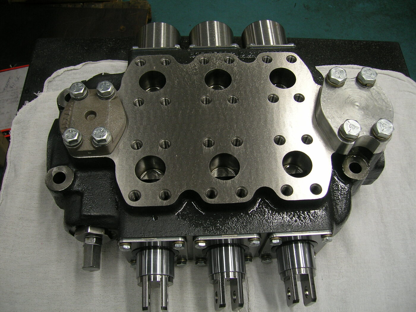Top view of a V38MMD107-A multi-section directional valve showing precision-machined work ports and mounting interface