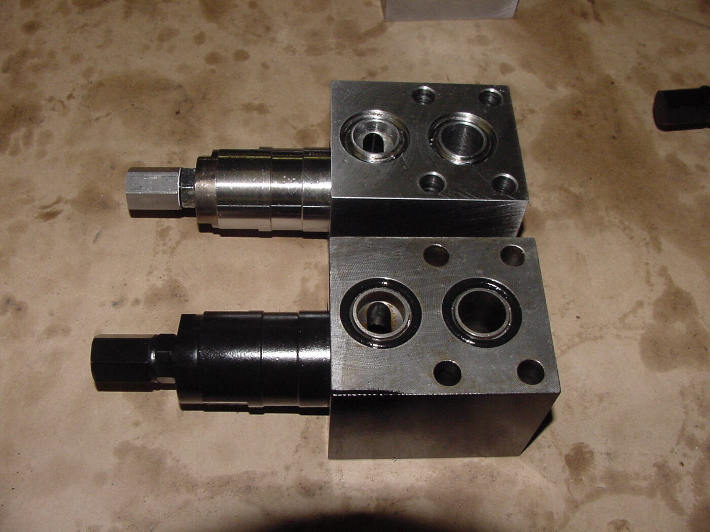 VR46X26 cartridge and spool assemblies — Hydreco-supplied core with Reidville-machined housing
