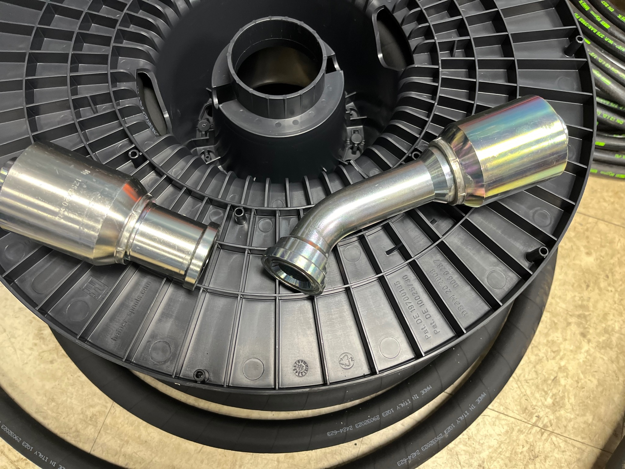 Custom hydraulic hose fittings and hose reel assembly on the Reidville workbench