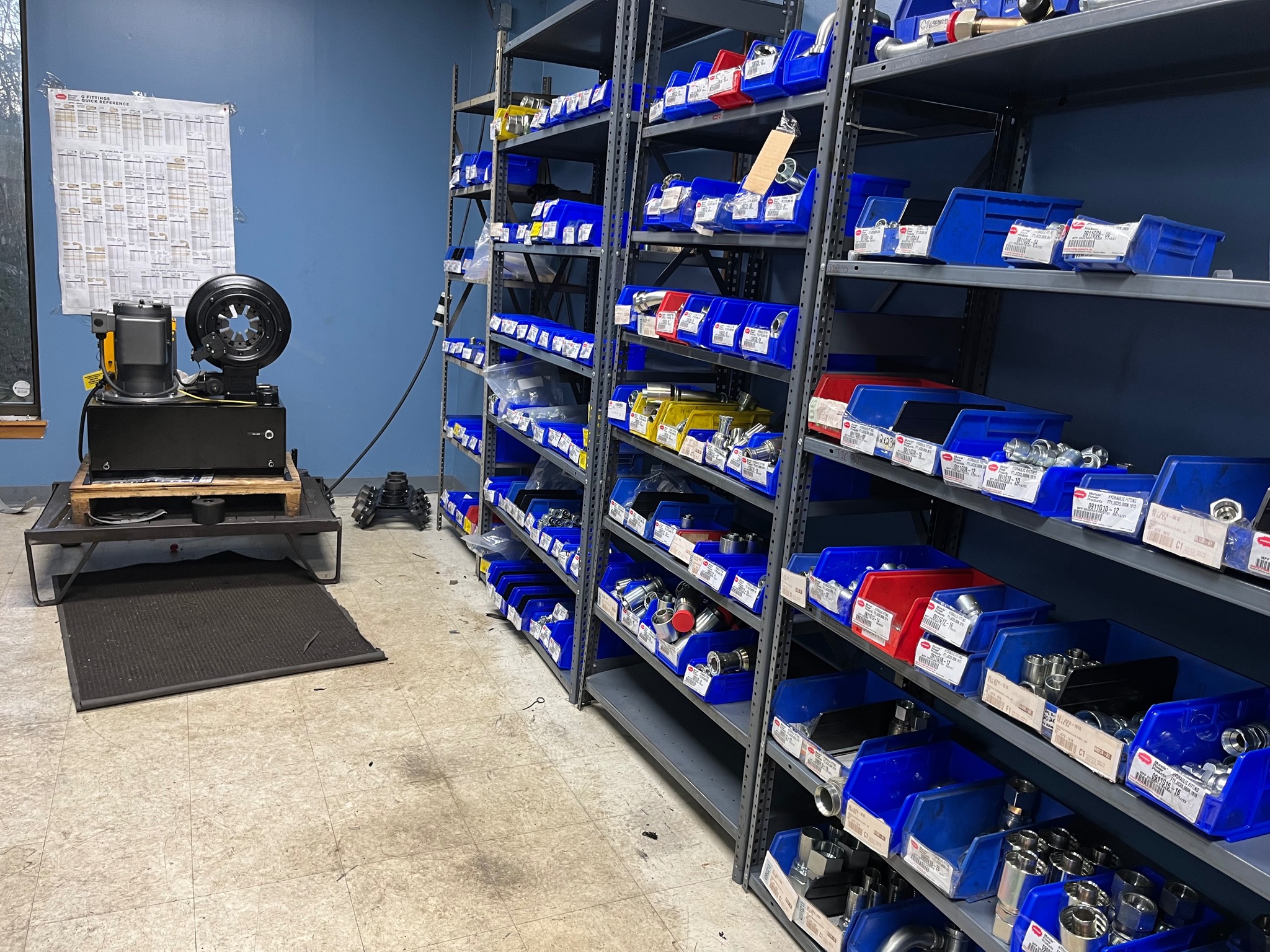 Parts room with hose crimper and fittings inventory